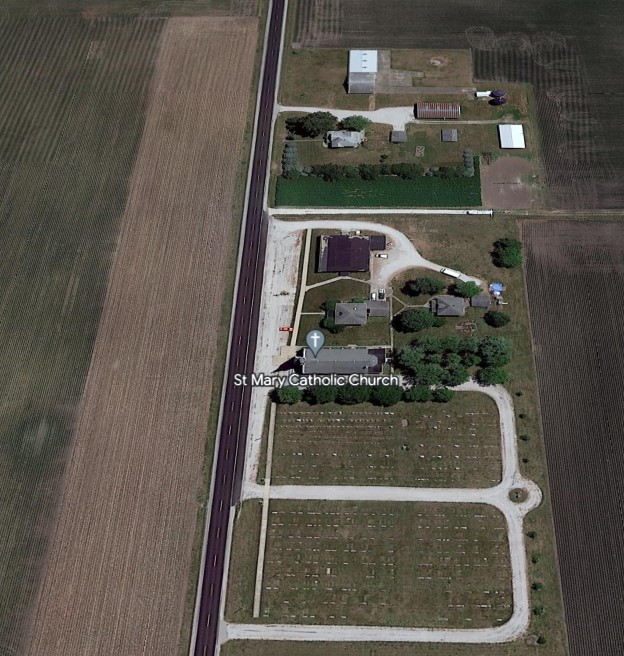 Close up view of the house and church as seen from above.